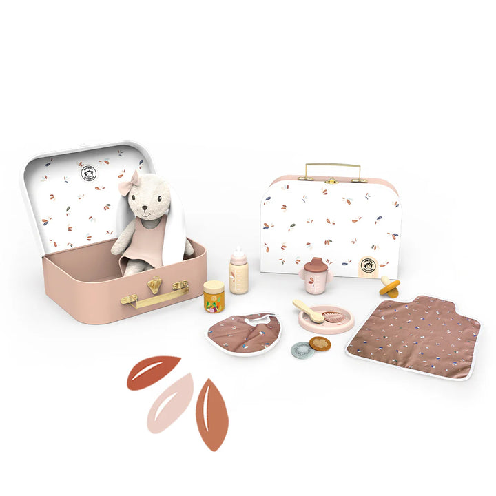 Collection of children's toys including a suitcase, teddy bear, and various items on a white background
