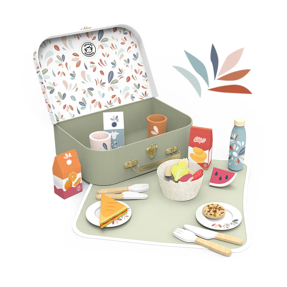 Children's picnic set with a suitcase, plates, cups, and food items on a white background