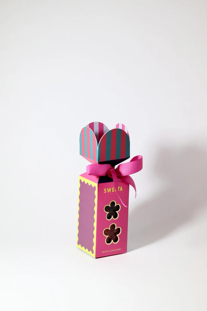 Pink gift box with striped bow on a white background